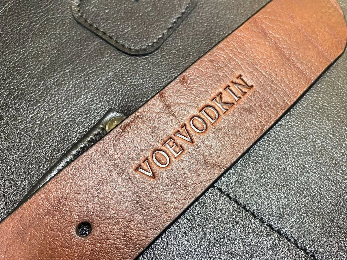 Коричневое полотно с тиснением «VOEVODKIN» на чёрной коже